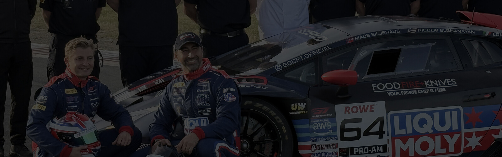 A race car with the Food Fire + Knives logo along with the chef and the team.